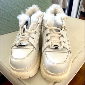 White sneakers fur trim. Slightly worn.
